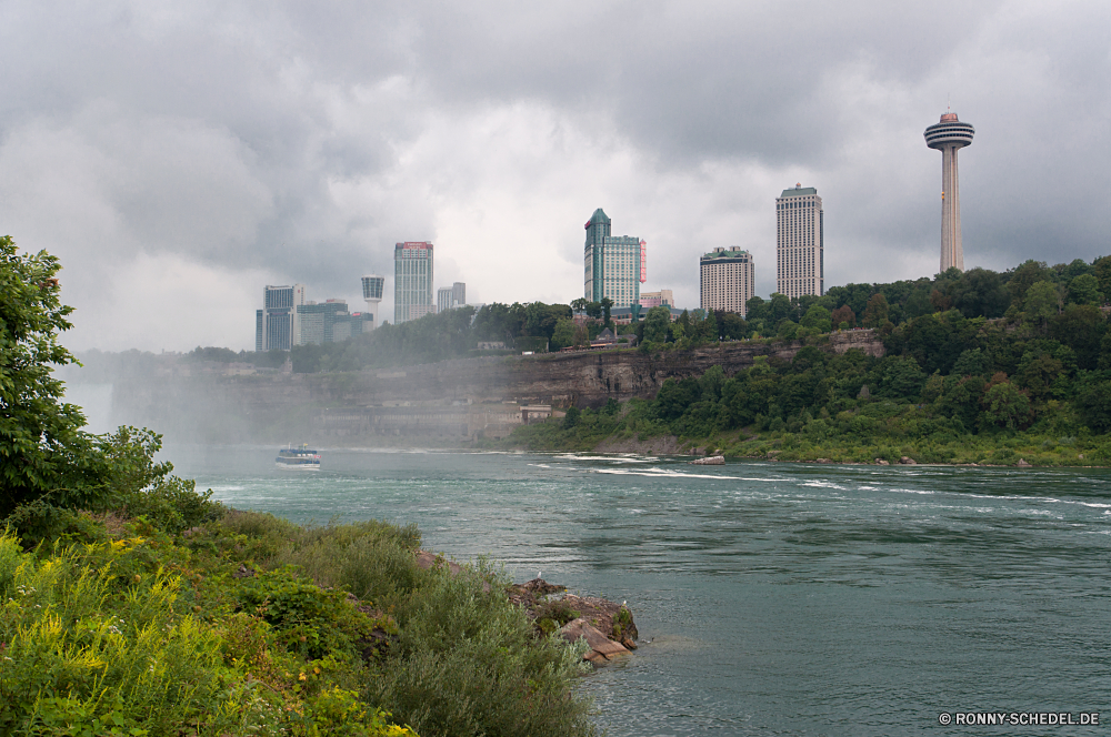 Niagara Falls Stadt Skyline Wellenbrecher Architektur Fluss Gebäude Urban Stadtansicht Wolkenkratzer Barrier Gebäude Wasser am Wasser Struktur Himmel Wolkenkratzer Obstruktion Innenstadt Reisen Brücke Turm moderne Wahrzeichen Küstenlinie Hafen Reflexion Tourismus Körper des Wassers Landschaft Ufer Kanal Geschäft Büro Ozean Boot Neu Bucht Stadt Panorama Meer landschaftlich Tourist Sonnenuntergang Küste Park groß am See Landkreis Anlegestelle Nacht Haus Metropole Dämmerung Zentrum Festung Kap Schloss Tag hoch Schiff Urlaub finanzielle Szene Ziel 'Nabend berühmte See Wolke Unternehmen Bau Wolken Urlaub Wohnungen Büros Metropolitan Zentrale Sommer Panorama Vereinigte Hauptstadt Bäume city skyline breakwater architecture river building urban cityscape skyscraper barrier buildings water waterfront structure sky skyscrapers obstruction downtown travel bridge tower modern landmark shoreline harbor reflection tourism body of water landscape shore channel business office ocean boat new bay town panorama sea scenic tourist sunset coast park tall lakeside district pier night house metropolis dusk center fortress cape castle day high ship vacation financial scene destination evening famous lake cloud corporate construction clouds holiday apartments offices metropolitan central summer panoramic united capital trees