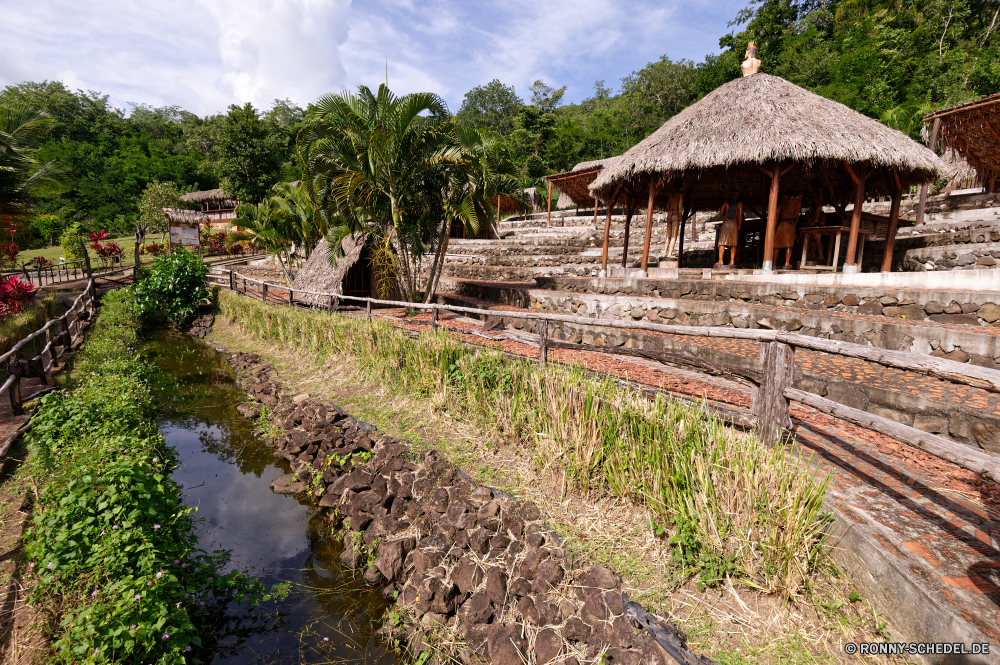 Martinique Stroh Dach Schutzüberzug Dorf Bespannung Haus Entwicklung des ländlichen Baum Architektur Landschaft Gebäude alt Reisen Land Sommer Himmel Gras Tourismus Hütte traditionelle Insel Wald Tropischer Startseite Landschaft Bauernhof Holz Hövel aus Holz Antike Stein Kultur Szenerie Feld Tempel Berg im freien Urlaub landschaftlich Wasser im freien Ziel Wolken Garten Pflanze Struktur Resort historischen Ferienhaus Bäume klar sonnig Paradies außerhalb Palm Tourist Küste Bungalow Tag Wolke England Tür Strand Ozean friedliche exotische Religion Geschichte natürliche Landwirtschaft Urlaub Hügel Mauer Immobilien Entspannen Sie sich Osten Wahrzeichen Wiese Fluss Meer thatch roof protective covering village covering house rural tree architecture landscape building old travel country summer sky grass tourism hut traditional island forest tropical home countryside farm wood hovel wooden ancient stone culture scenery field temple mountain outdoor vacation scenic water outdoors destination clouds garden plant structure resort historic cottage trees clear sunny paradise outside palm tourist coast bungalow day cloud england door beach ocean peaceful exotic religion history natural agriculture holiday hills wall estate relax east landmark meadow river sea