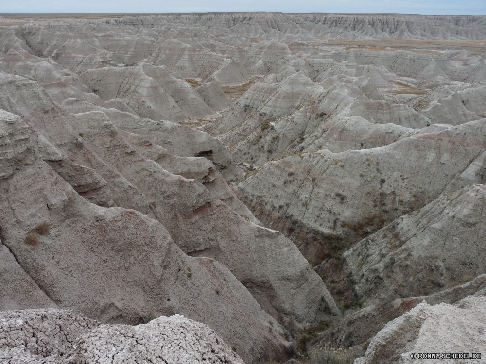 Badlands National Park Fels Stein Mauer Landschaft Wüste Klippe Geologie Berg Sand Schlucht nationalen Park Backstein Sandstein Reisen Felsen im freien geologische formation Tal Baumaterial natürliche Textur Himmel Erde landschaftlich Berge Muster Rau Grab Tourismus Hügel trocken Antike Struktur Umgebung Braun texturierte Boden Aushöhlung Land alt niemand Oberfläche Tag Cliff-Wohnung Wildnis Mineral Hügel Sommer Stuck Bereich Steine Wolken Farbe geologische Südwesten Extreme Szene Architektur Wasser Osten Wohnung im freien Boden Material Tourist Wahrzeichen Küste Bildung Gebäude Krater Wolke Schmutz Orange Wärme Bereich Fluss Granit Ruine geknackt Gelände Bau außerhalb Abenteuer Ringwall horizontale Küste Süden Ziel Stadt Schließen natürliche depression historischen ruhige Detail schmutzig Grat Marmor Baum Meer rock stone wall landscape desert cliff geology mountain sand canyon national park brick sandstone travel rocks outdoors geological formation valley building material natural texture sky earth scenic mountains pattern rough grave tourism hill dry ancient structure environment brown textured soil erosion land old nobody surface day cliff dwelling wilderness mineral hills summer stucco area stones clouds color geological southwest extreme scene architecture water east dwelling outdoor ground material tourist landmark coast formation building crater cloud dirt orange heat range river granite ruins cracked terrain construction outside adventure rampart horizontal coastline south destination city close natural depression historic tranquil detail dirty ridge marble tree sea