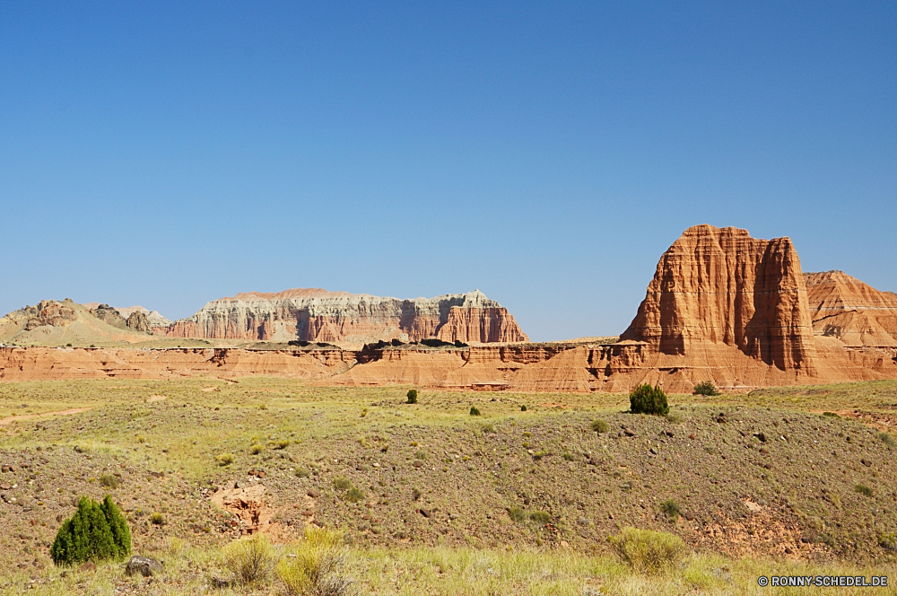 Capitol Reef National Park - Cathedral Valley Wüste Landschaft Berg Fels Hochland Himmel Land Schlucht Park Berge Reisen Tal Steppe Sand nationalen Darm-Trakt Reiner trocken Stein Hügel landschaftlich im freien Sandstein Wildnis Sommer Tourismus natürliche im freien Baum Wolken Entwicklung des ländlichen Arid Szenerie Aushöhlung Klippe Felsen Feld Wild Südwesten sonnig Land Umgebung Wolke Knoll Schlucht Tag Denkmal Szene Spitze Bereich Gras Geologie Gelände Hügel Urlaub Landschaft Pflanze Straße Wiese Westen Bildung Abenteuer Reise niemand Tourist heiß Wasser Horizont Grand Landschaften gelb Düne Wahrzeichen Mesa Sonne Schmutz Bereich Panorama Orange Wärme Braun Fluss Bäume Butte Formationen geologische Wald reservieren entfernten Pfad bewölkt Sonnenuntergang Öffnen Frühling Heu desert landscape mountain rock highland sky land canyon park mountains travel valley steppe sand national tract plain dry stone hill scenic outdoor sandstone wilderness summer tourism natural outdoors tree clouds rural arid scenery erosion cliff rocks field wild southwest sunny country environment cloud knoll ravine day monument scene peak range grass geology terrain hills vacation countryside plant road meadow west formation adventure journey nobody tourist hot water horizon grand scenics yellow dune landmark mesa sun dirt area panorama orange heat brown river trees butte formations geological forest reserve remote path cloudy sunset open spring hay